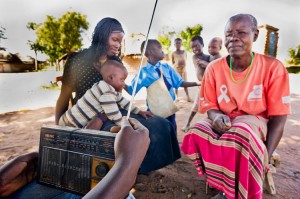 rsz_family_listening_to_radio_in_patongo4-300x199